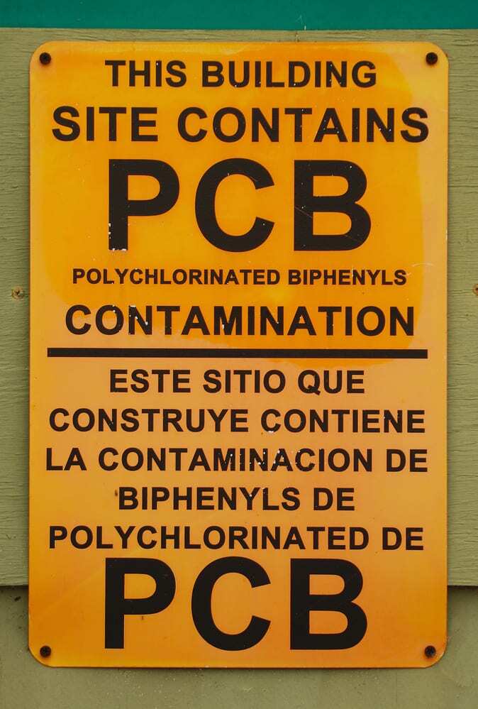 PCB Alert Sign in English and Spanish